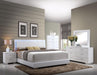 Lorimar White PU & Chrome Leg Eastern King Bed - Home Furniture And More (Brentwood, MD)