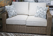 Laguna Heights Outdoor Loveseat with Cushion - Home Furniture And More (Brentwood, MD)
