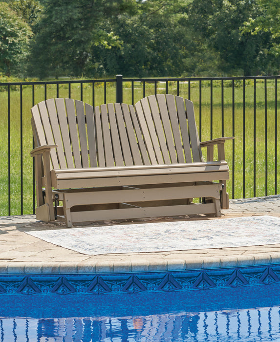 Hyland wave Outdoor Glider Loveseat - Home Furniture And More (Brentwood, MD)