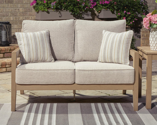 Hallow Creek Outdoor Loveseat with Cushion - Home Furniture And More (Brentwood, MD)