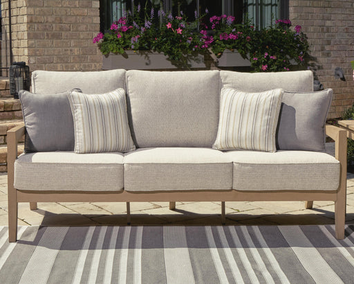 Hallow Creek Outdoor Sofa with Cushion - Home Furniture And More (Brentwood, MD)