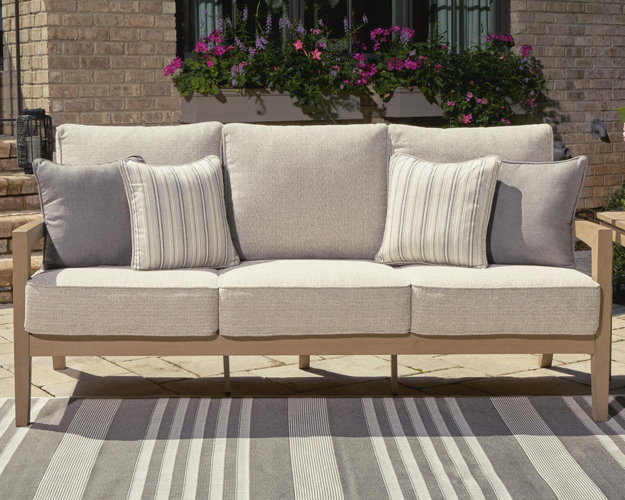 Hallow Creek Outdoor Sofa with Cushion - Home Furniture And More (Brentwood, MD)
