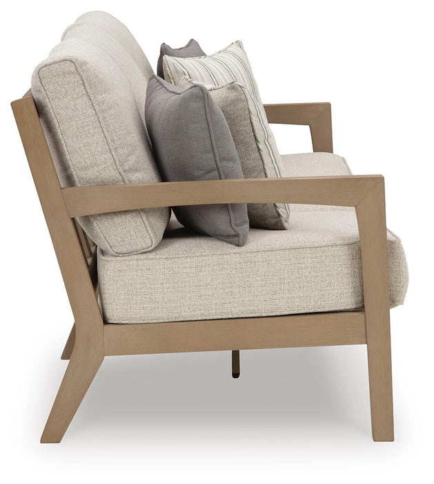 Hallow Creek Outdoor Sofa with Cushion - Home Furniture And More (Brentwood, MD)