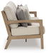 Hallow Creek Outdoor Sofa with Cushion - Home Furniture And More (Brentwood, MD)