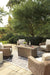 Beachcroft Beachcroft Fire Pit Table with Four Nuvella Swivel Lounge Chairs - Home Furniture And More (Brentwood, MD)