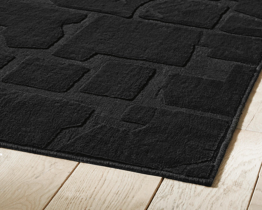 Gibbswell Washable 5' x 7' Area Rug - Home Furniture And More (Brentwood, MD)