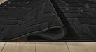 Gibbswell Washable 8' x 10' Area Rug - Home Furniture And More (Brentwood, MD)