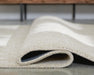 Wolbert 7'8" x 10' Area Rug - Home Furniture And More (Brentwood, MD)