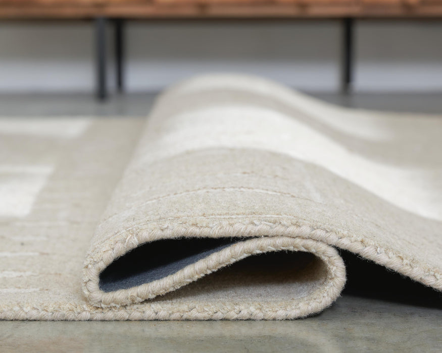 Wolbert 5' x 7' Area Rug - Home Furniture And More (Brentwood, MD)