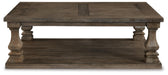 Johnelle Coffee Table - Home Furniture And More (Brentwood, MD)